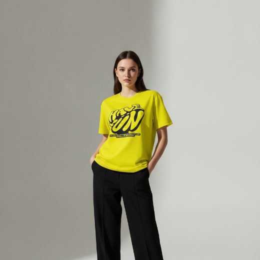 AI mockup result — model in yellow graphic tee, studio